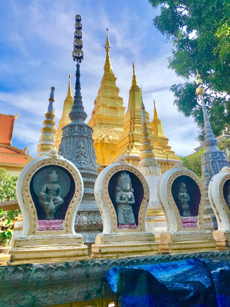 Images of bodhisattvas adorn the perimeter of a Phnom Penh pagoda courtyard, one of nearly 4,700 in Cambodia.