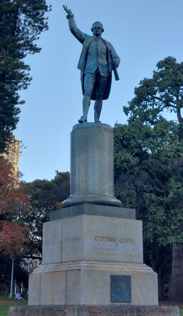 A statue of Captain James Cook clutching a telescope stands in Sydney’s Hyde Park opposite the Australian Museum 