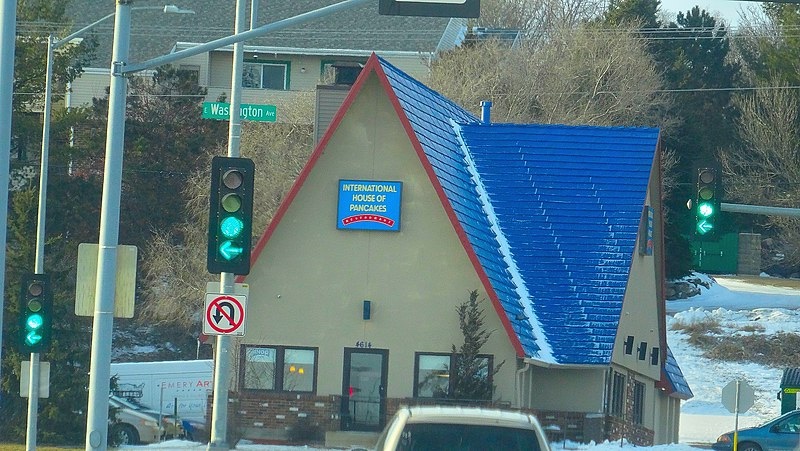 International House of Pancakes was instantly recognizable by their bright blue roofs. Today it simply is called IHOP.