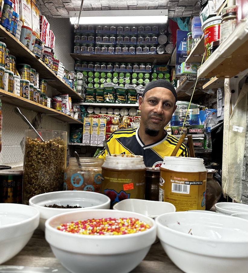 A vendor in his sweet Pan (beetle nut) shop.