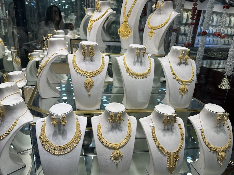 A store on 74th St., displays gold jewellery.