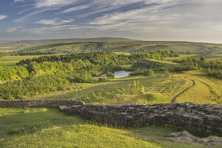 The most intact section of Hadrian’s Wall, here with Clough Loch in the distance, runs through a remote area inside Northumberland National Park. 