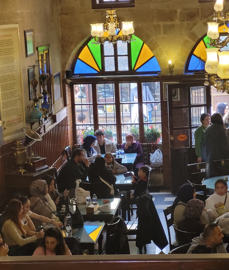 Tahmis Kahvesi interior Gaziantep, Turkey. Children learn early to appreciate Turkish coffee.