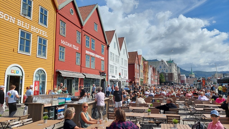 Tourists visiting Bergen flock to Bryggen’s colorful waterfront, gable-roofed buildings filled with shops, galleries and restaurants.