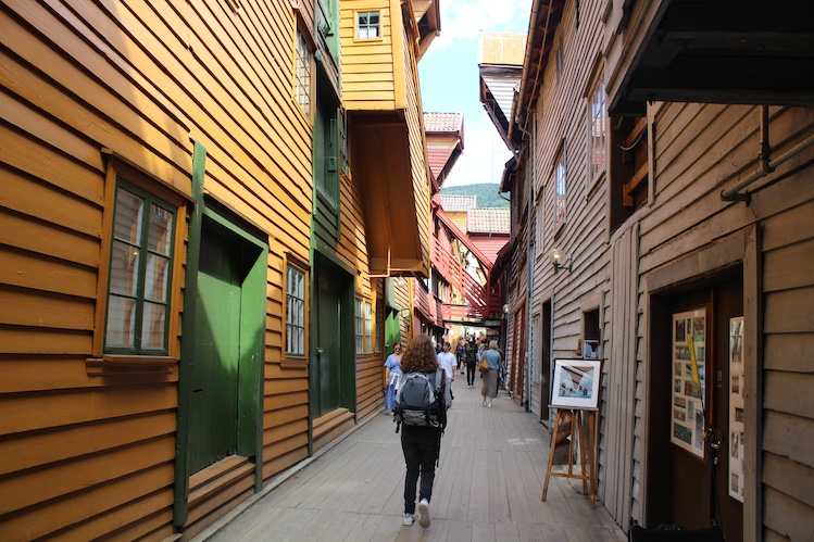 Long narrow corridors and alleyways now lined with shops separate the restored and rebuilt warehouses at the Bryggen waterfront. 