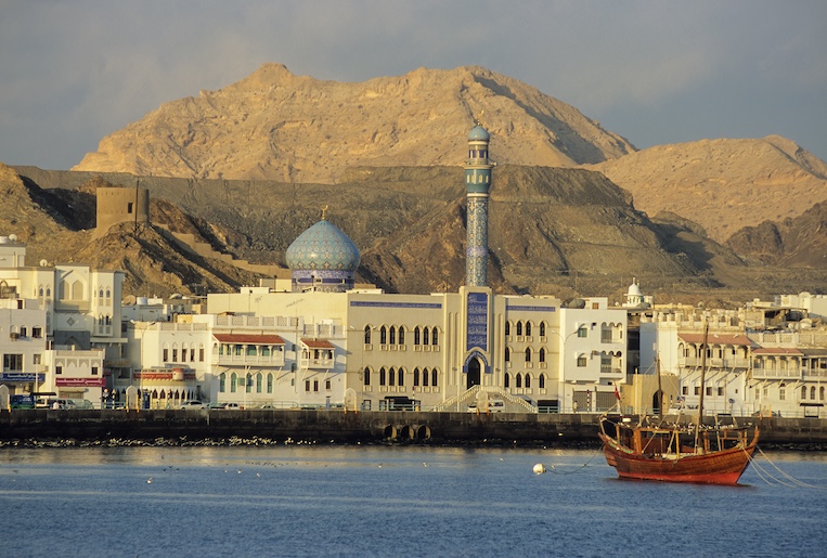 A Shia mosque, and traditional waterfront architecture line the harbor of Mutrah, commercial port for Oman's capital, Muscat.